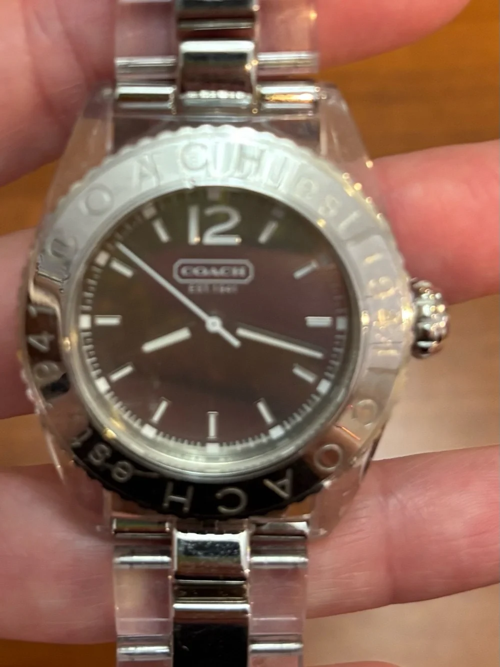 Coach women’s Silver Tone Watch with Black Dial and clear acrylic band